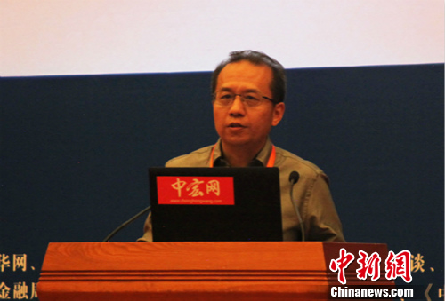 中国人民银行征信中心主任王煜演讲中。